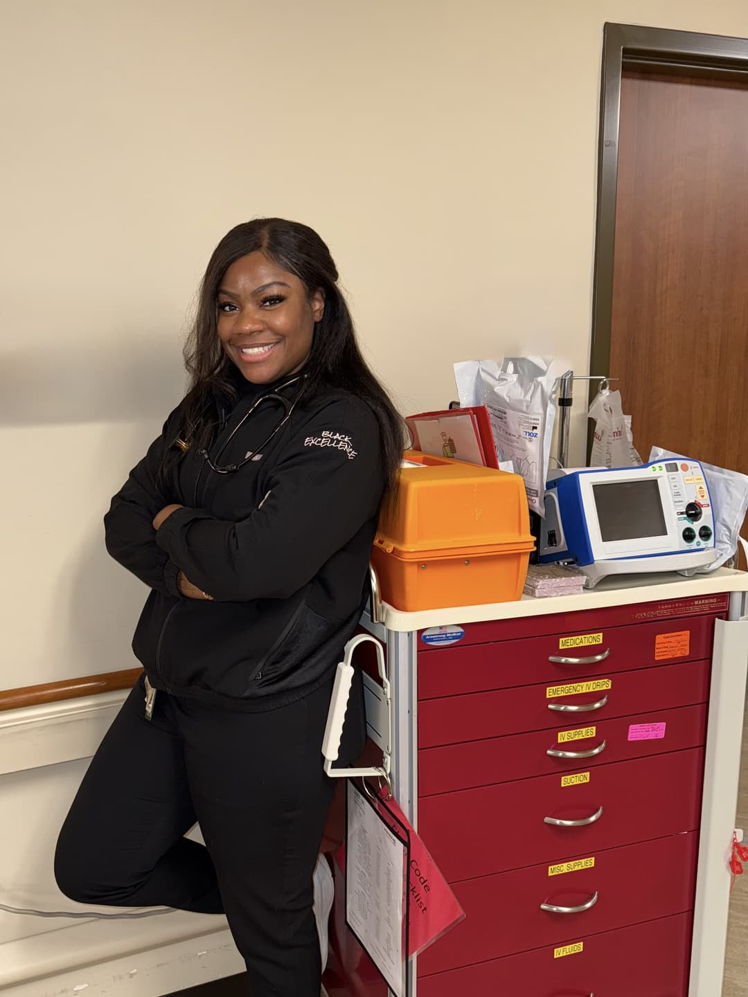 Dr. Helene in black scrubs